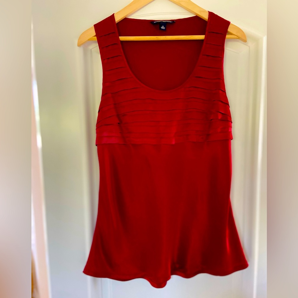 Burgundy sleeveless Banana Republic blouse.